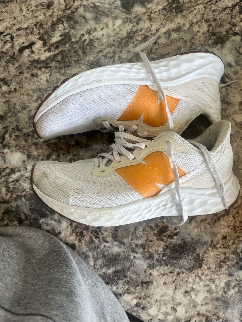 New Balance White and Gold Athletic Shoes